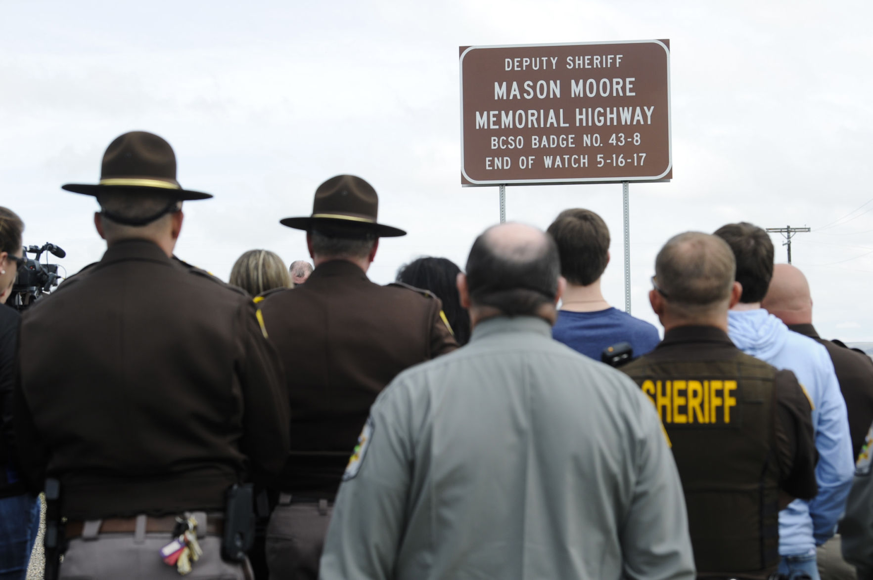 People gather on Highway 287